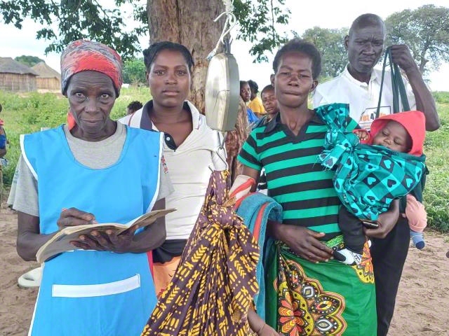 Hands holding a child sponsorship photo card