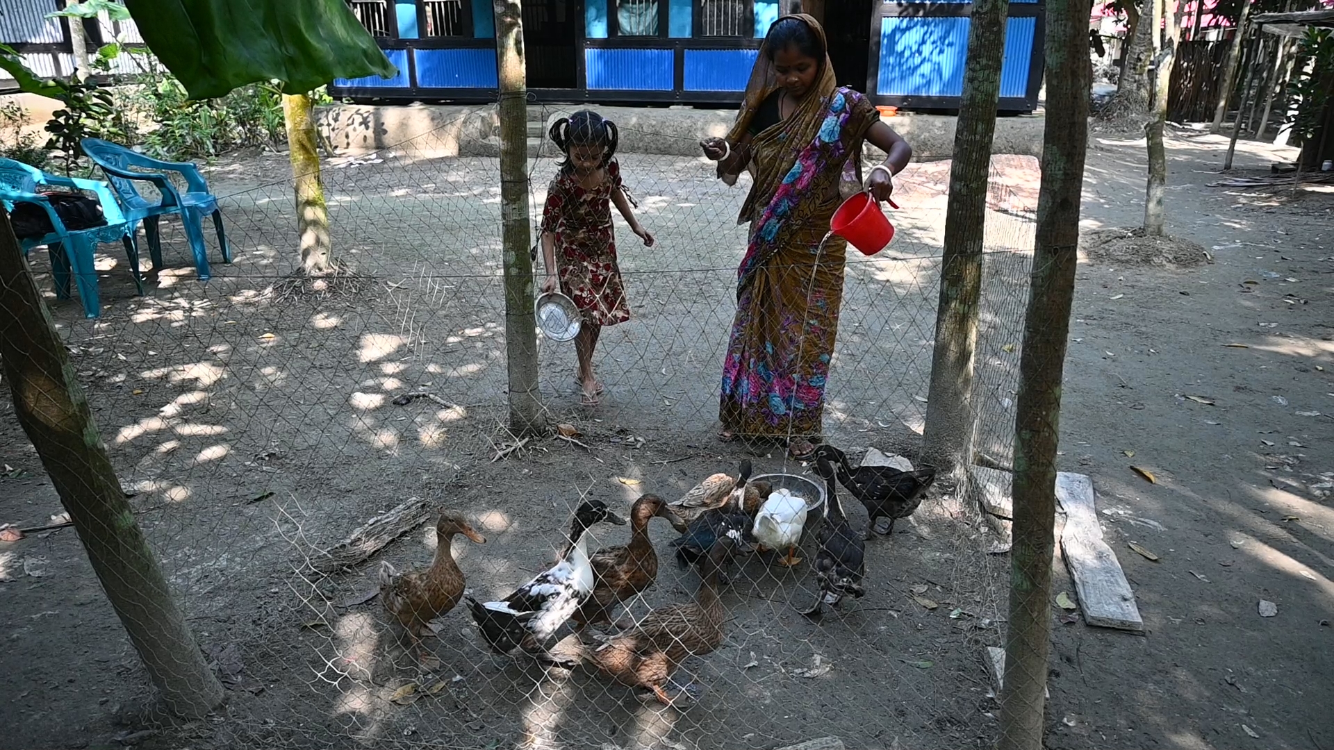 Hands holding a child sponsorship photo card